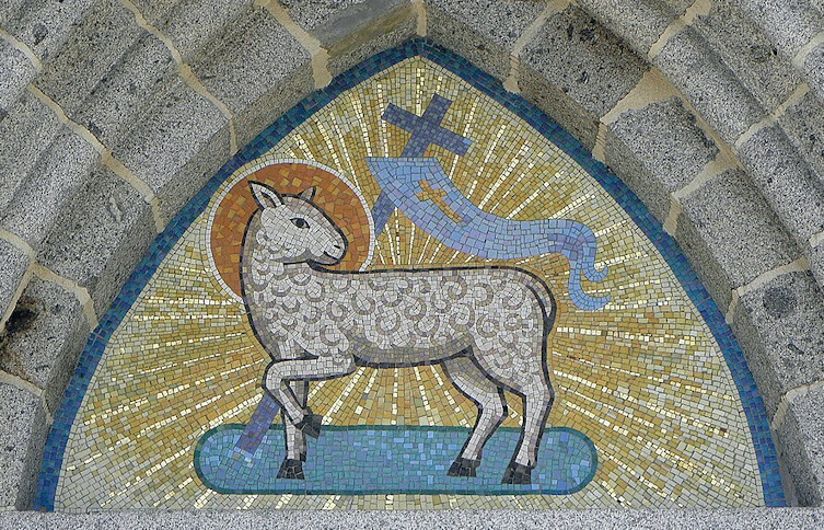 Mosaic of a lamb with a halo giving off light. A cross and a banner are attached to it