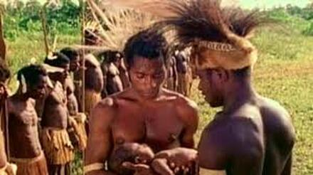 A tribal chief gives away his son to another tribe during a traditional peacemaking ceremony