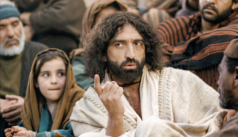 Jesus speaking with his finger pointing at the person to whom He is speaking