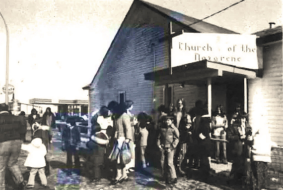 old Nazarene church building with people coming out of it