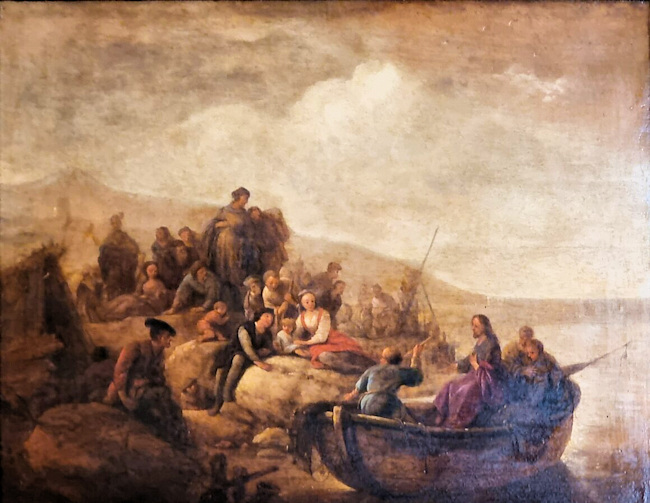 Jesus sitting in a boat preaching to people who are seated on large rocks on the shore