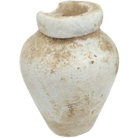 Tiny round stone container with a small piece broken at the top