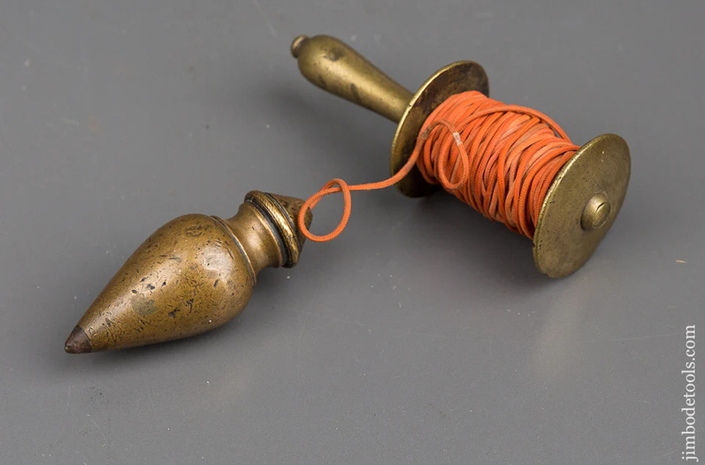 Antique plumb bob and cord