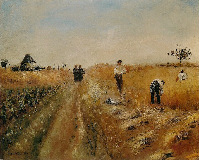 People in a field cutting ripe grain by hand