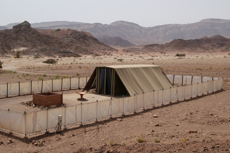 Model of the ancient Israelite tabernacle inside a fenced courtyard with the tented sanctuary
